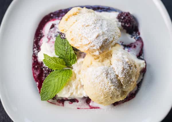 Warm Jumbleberry Shortcake w/ Buttermilk Biscuit, Fresh Whip Cream & Powdered Sugar