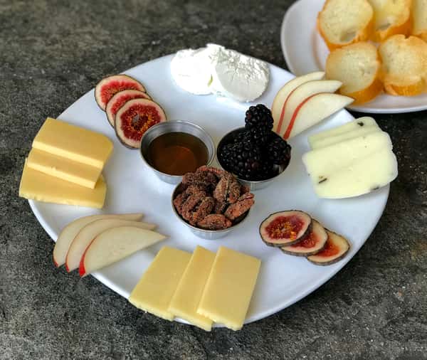 Cheese Plate w/ Black Truffle Cheese, Goat Cheese, Smoked Gouda, White Cheddar, Red Pears & Baguette