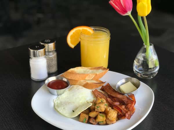 Two Eggs Any Style w/ Applewood Smoked Bacon, Roasted Potatoes, Cornbread & Honey 