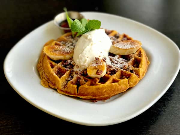 Pumpkin Oatmeal Waffle w/ Caramelized Bananas, Candied Pecans & Real Maple Syrup