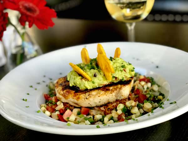 Grilled Cajun Swordfish w/ Chili Style Black Bean Puree, Red Rice, Roasted Corn Salsa & Guacamole