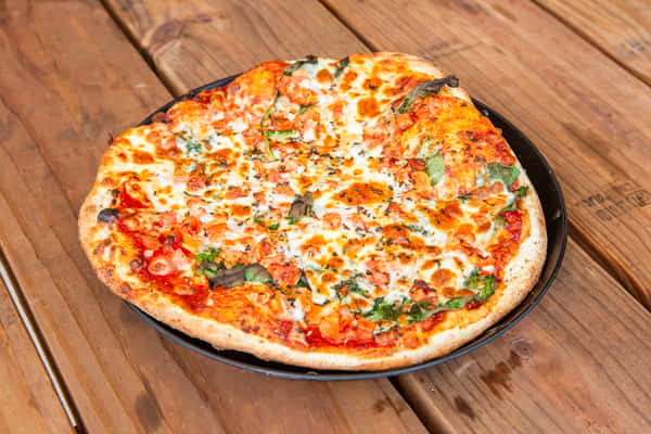 Margherita pizza with melted cheese, tomatoes, and herbs at Jimmy's Burgers & Pizza