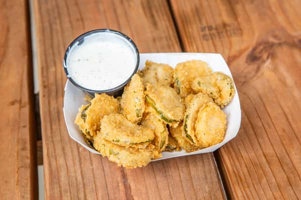 Crispy fried dill pickles served with creamy dipping sauce at Jimmy's Burgers & Pizza