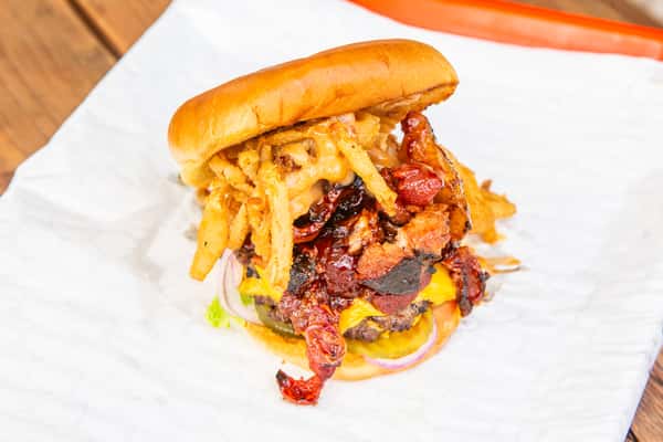 Cowboy burger piled with bacon, cheese, and crispy onions at Jimmy's Burgers & Pizza in Hurst, TX