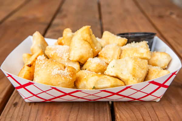 Golden Parmesan puff bites served at Jimmy's Burgers & Pizza in Hurst, TX