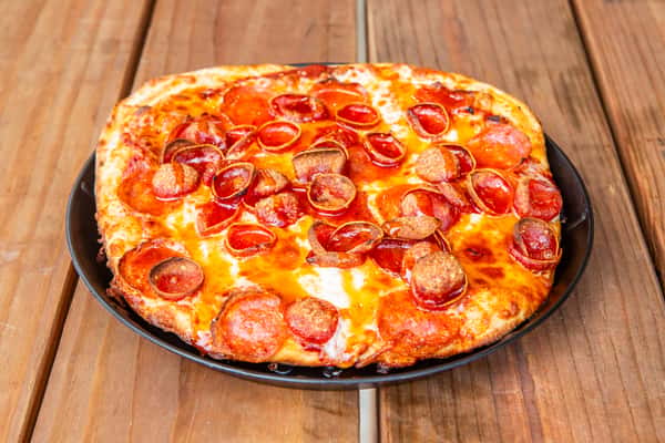 Fresh pepperoni pizza with melted cheese and a crisp crust at Jimmy's Burgers & Pizza