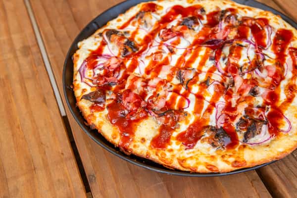 Burnt ends pizza with savory barbecue sauce and melted cheese at Jimmy's Burgers & Pizza