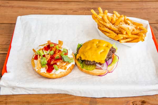 Crab Rangoon burger with cheese and flavorful toppings served with fries at Jimmy's Burgers & Pizza