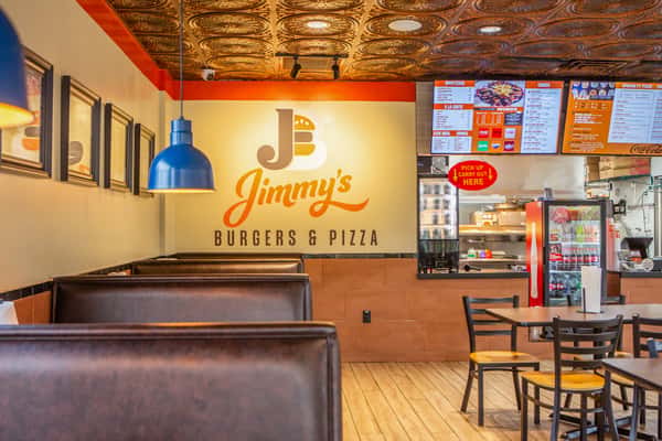 Casual dining area inside Jimmy's Burgers & Pizza in Hurst, TX