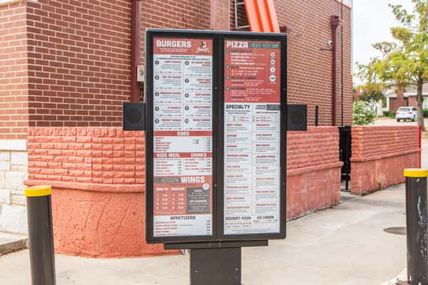 Outdoor menu board at Jimmy's Burgers & Pizza in Hurst, TX