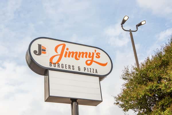 Roadside Jimmy's Burgers & Pizza restaurant sign in Hurst, TX