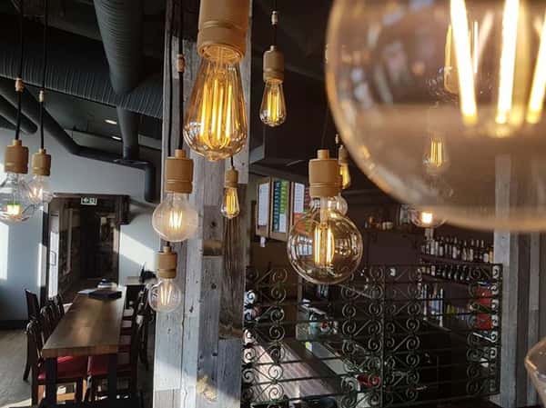 interior area showcasing lightbulbs hanging from the ceiling