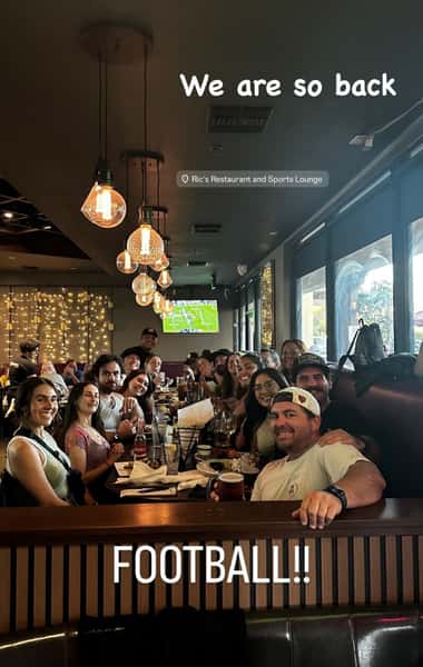 Happy customers in a large group celebrating