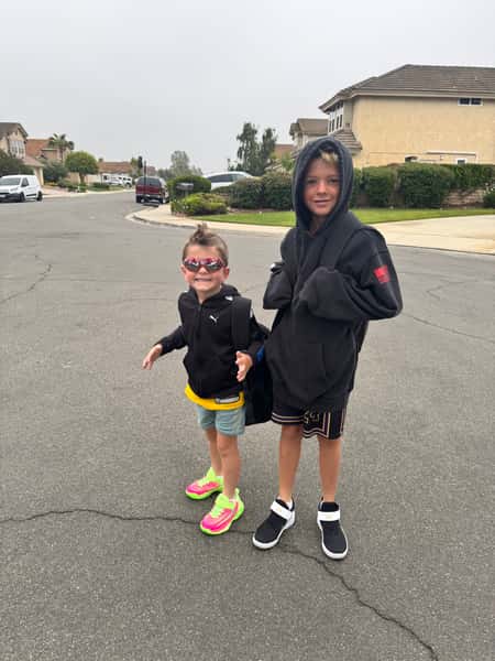 Happy boys posing on a street