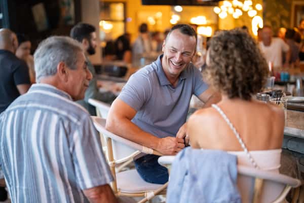 Happy diners eating inside Dear Olivia restaurant