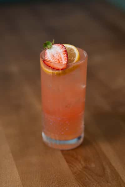 Cocktail with a strawberry and citrus slice