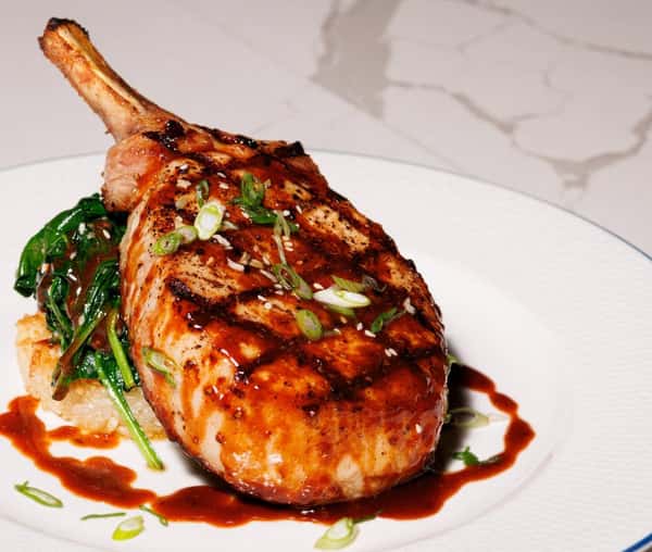 Grilled pork chop with greens