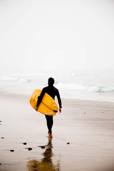 Surfer walking