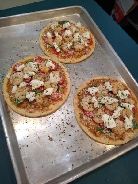 assorment of pizza's on a tray