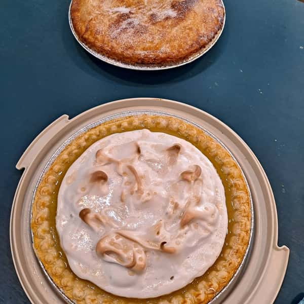 coconut pie topped with whipped cream