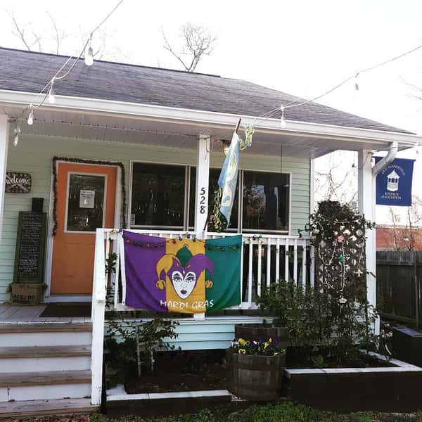 outside of business with mardigras decor