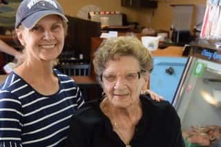 two females posing for picture