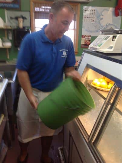 man pouring ice