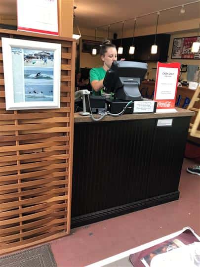 employee working behind register