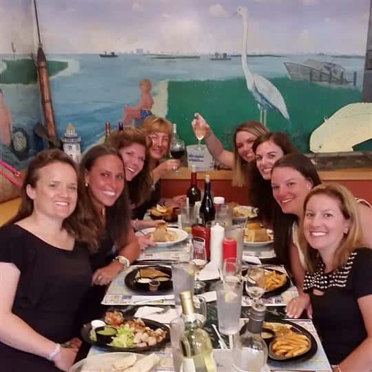 group of women enjoying a meal inside restaurant