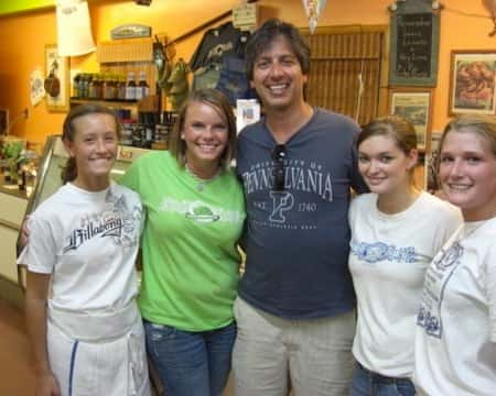 three females posing with ray ramano