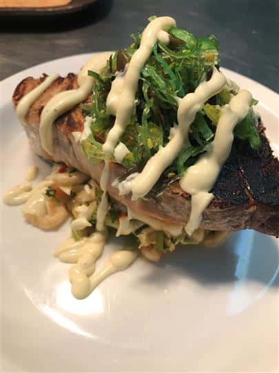 fish drizzled with sauce