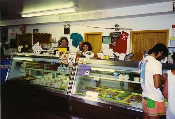two females standing behind counter