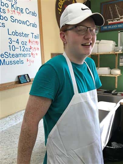 employee wearing hat and apron
