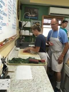 employees cutting up food