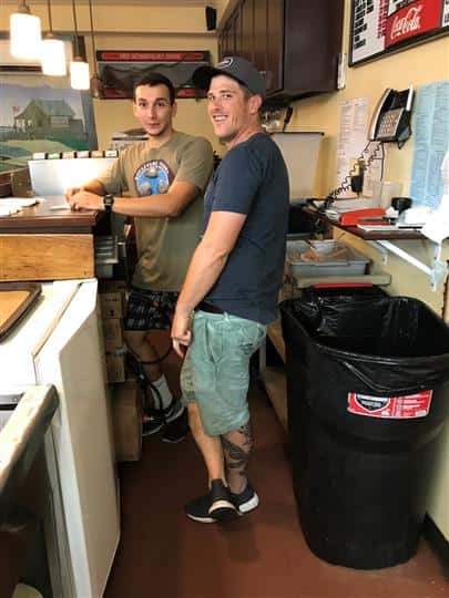 two employees behind counter