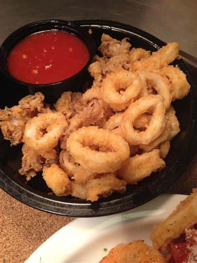 onion rings and fried fish with dipping sauce