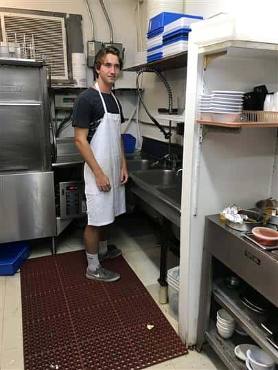 employee washing dishes