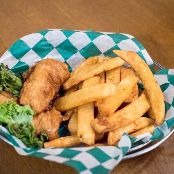 fried cod fish in a basket with fries