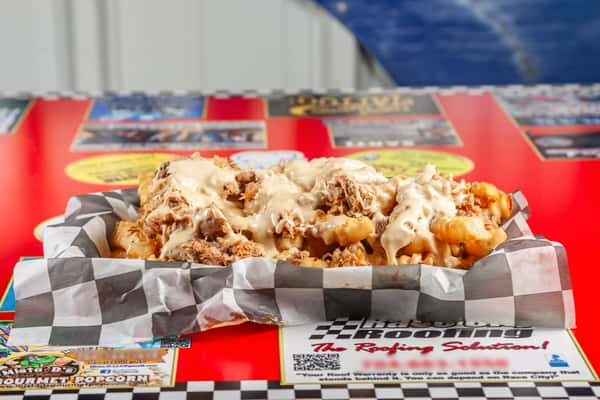Crispy fries topped with your choice of Eastern NC style BBQ, or chicken covered in queso