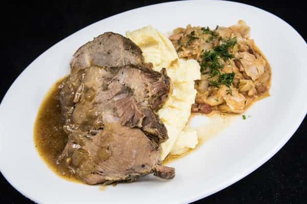 roasted pork shoulder with cabbage and potatoes