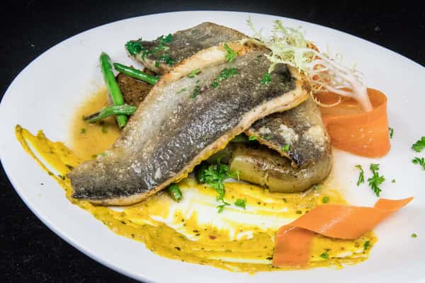 Trout dish with sauce and vegetables