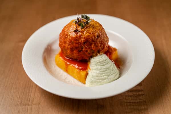 Meatball over polenta