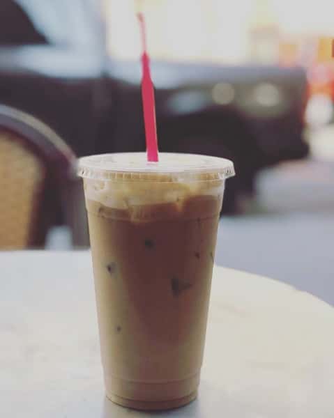 Iced coffee with plastic straw