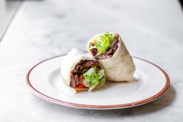 Steak wrap with lettuce on plate