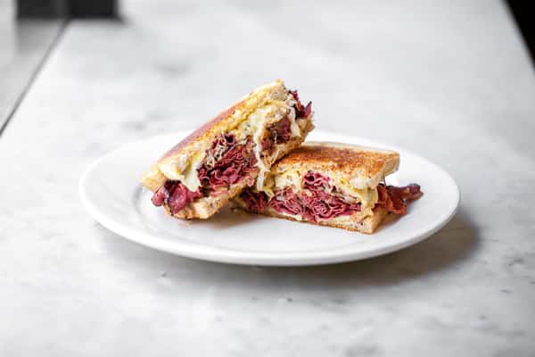 Pastrami with cole slaw on toasted rye bread