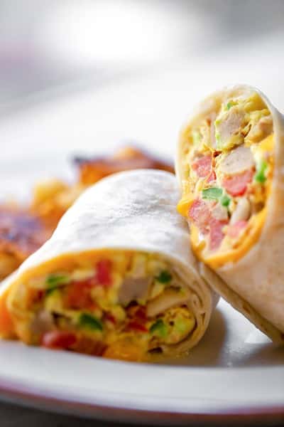 Egg and ham wrap with side of home fries