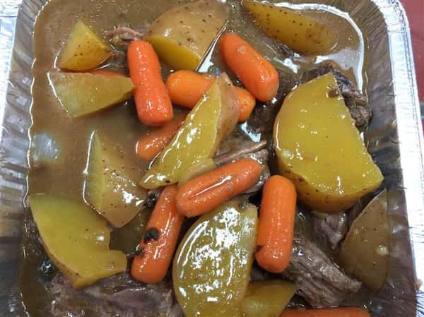 A tray of homemade roast and vegetables.