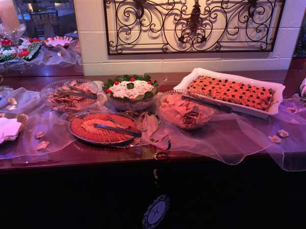 An interior buffet with several trays and bowls