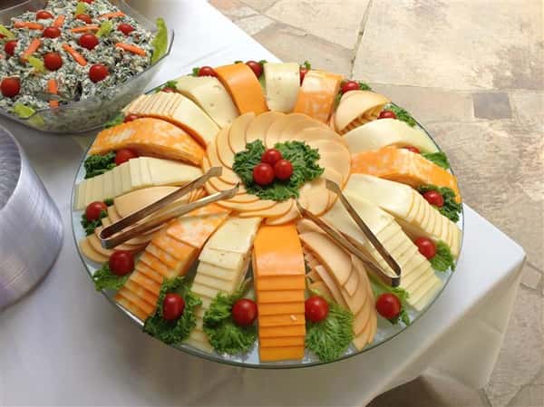 A decorated tray of cheeses