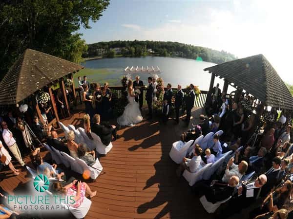 outdoor lakeside wedding ceremony on the deck